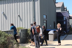 conference attendees heading to lunch, one waves to the camera